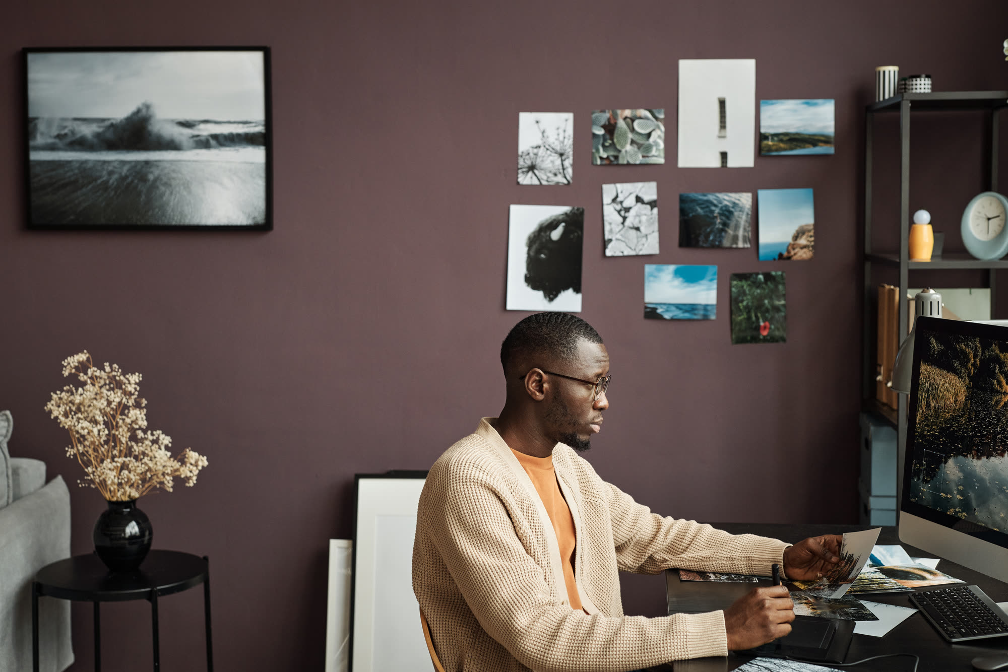 Black creative director reviewing advert design concepts