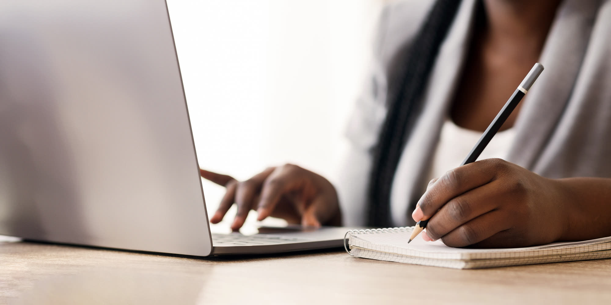 Black female entrepreneur reading and researching digital marketing insights