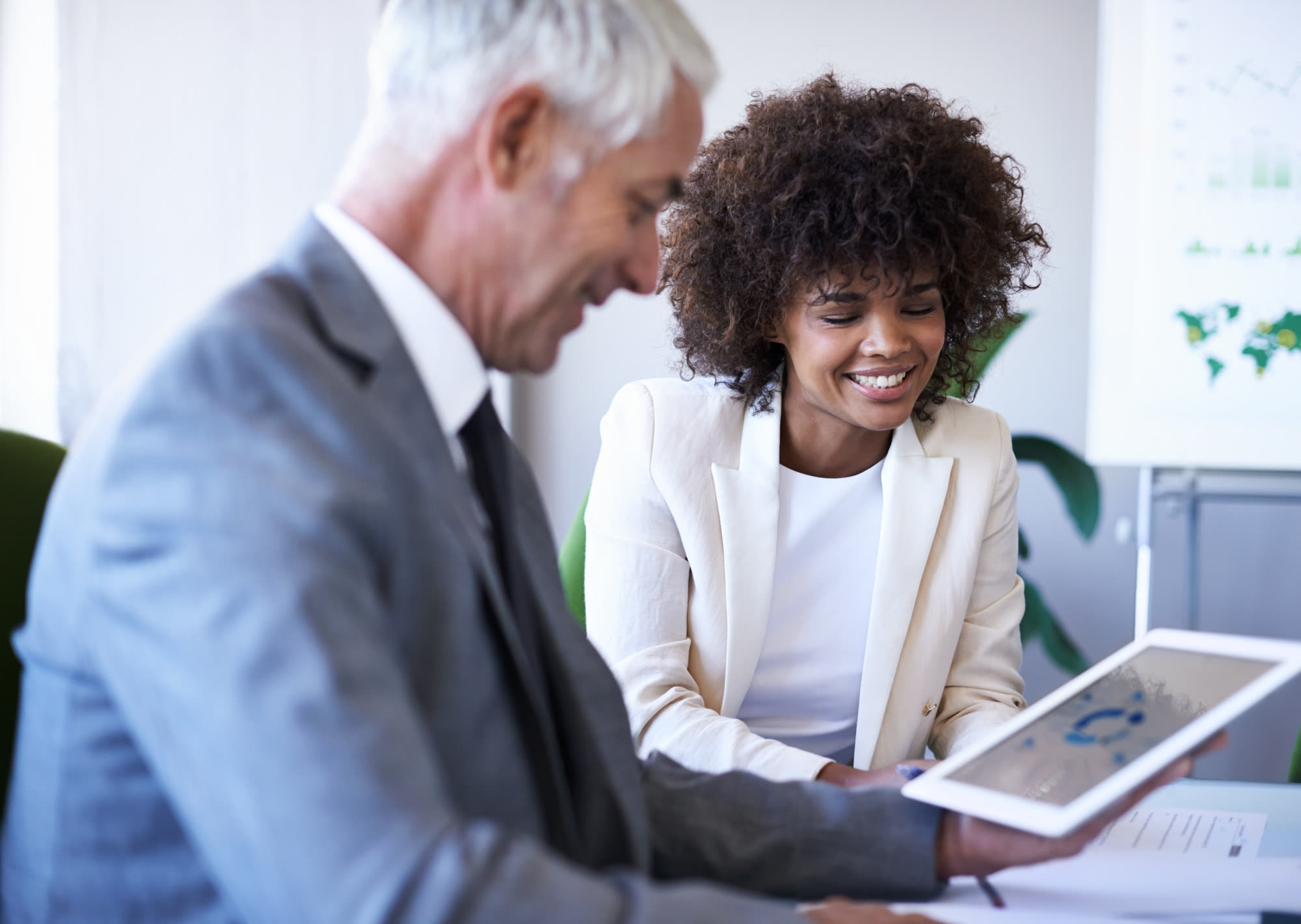 Diverse team of financial consultants reviewing a website pricing quote