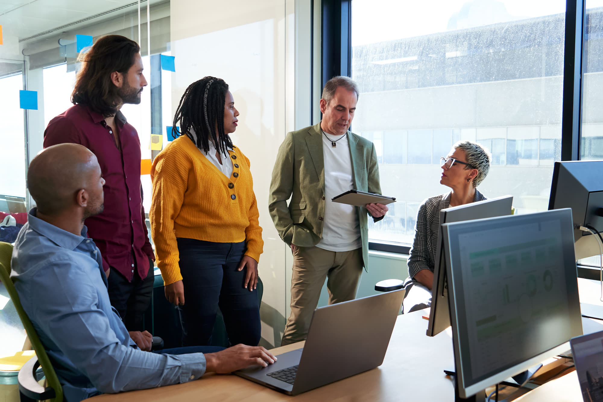 Diverse business team collaborating on digital marketing and web design services